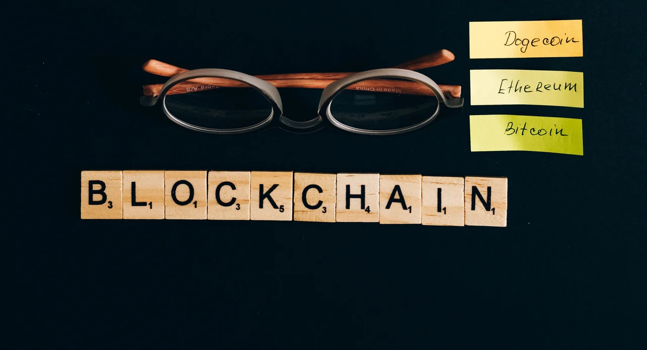 A series of wooden blocks spelling out the word 'Blockchain'.