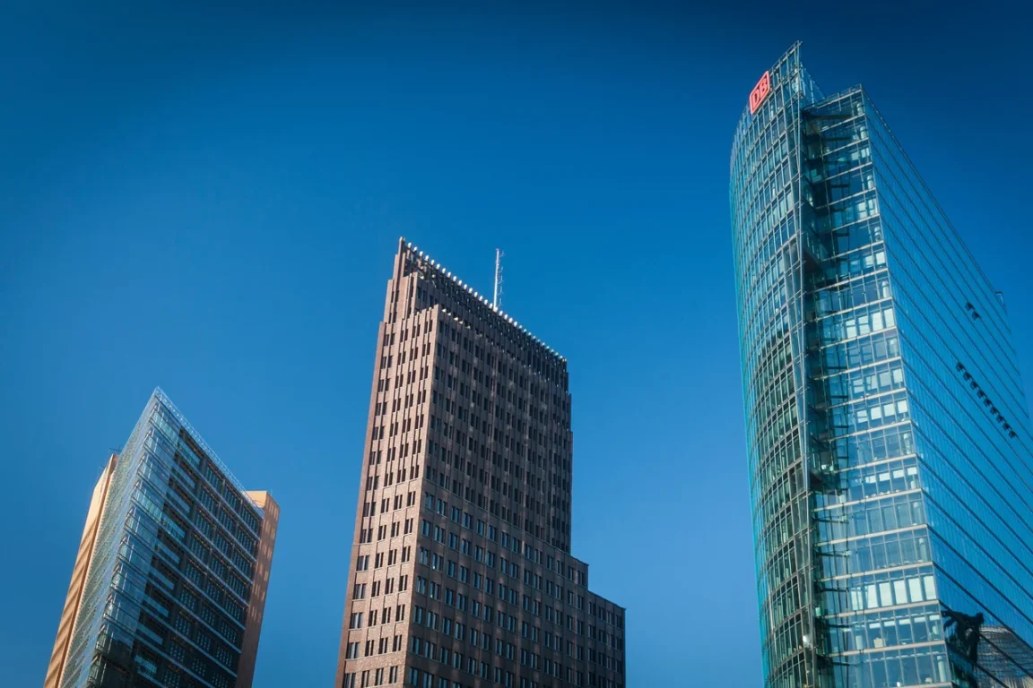 Three skyscrapers against a clear blue sky.