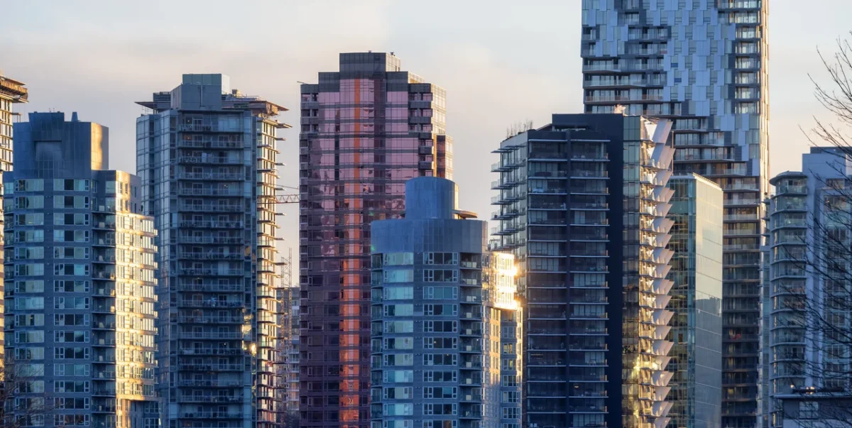 A city skyline with large, glass skyscrapers.