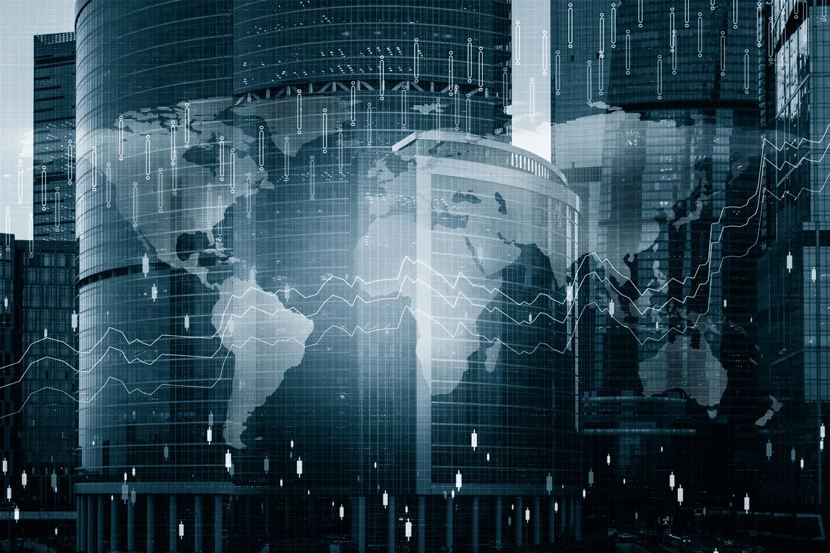 A world map projected onto skyscrapers.