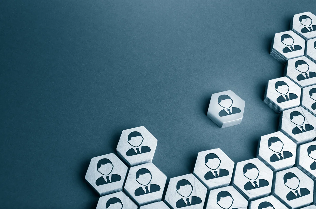 A collection of hexagonal tiles with portraits of people on them.