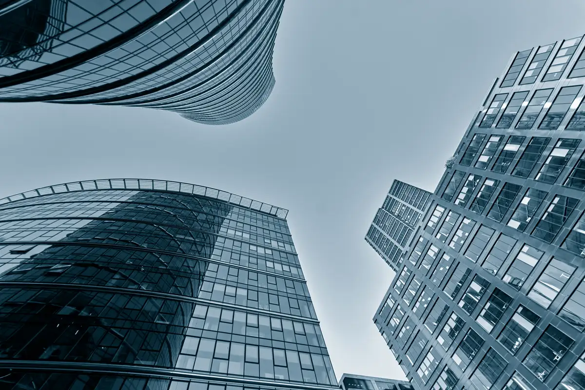 Large office buildings photographed from street level.