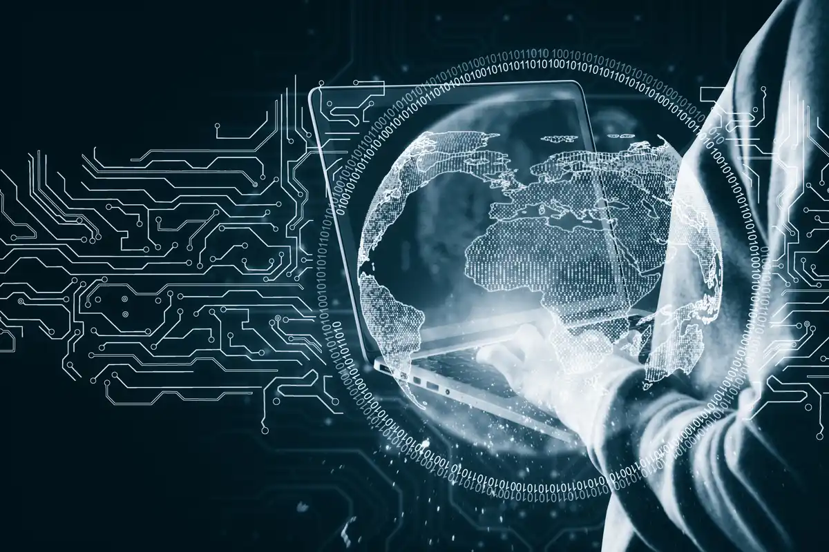 A person holding a laptop.