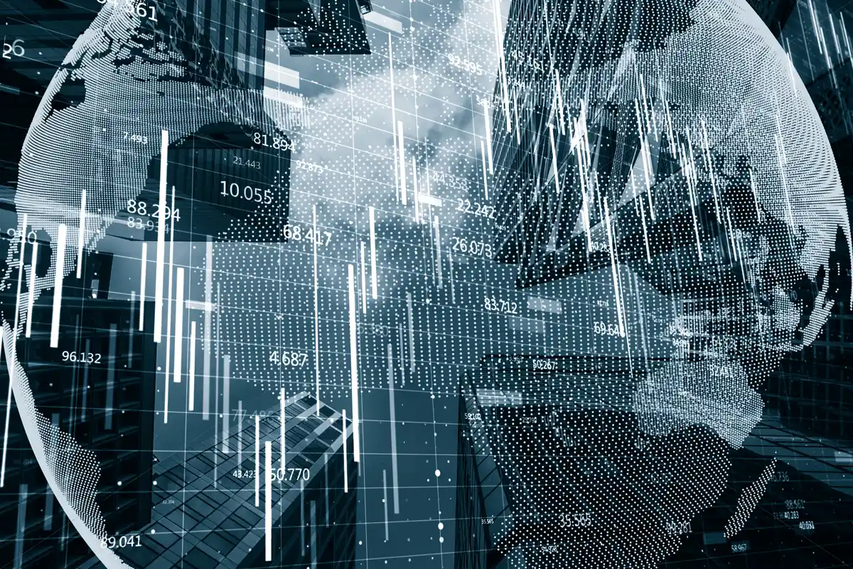 A projection of Earth in front of office buildings.